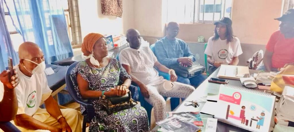 community leaders recieving welcoming wydif voluntees at the local health center